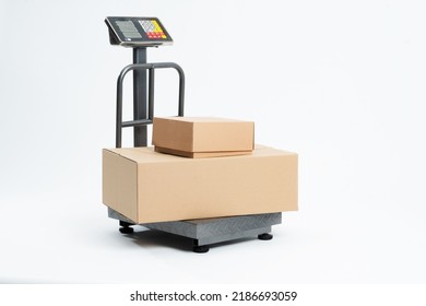 Industrial scale for weighing parcels for shipping with adhesive tape for packaging. Industrial scale isolated on white background. - Shutterstock ID 2186693059