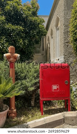Industrial Scene with Fire Hydrant and Red Metal Cabinet