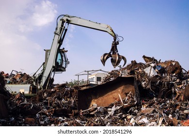 Industrial scrap metal recycling in junkyard. - Shutterstock ID 2018541296