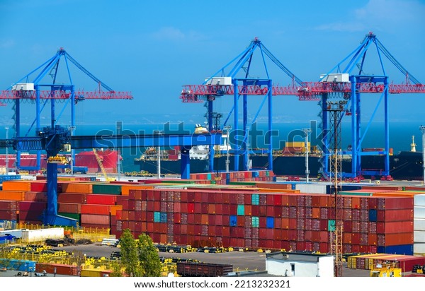 industrial seaport infrastructure,\
commercial dock and container warehouse, sea, cranes and cargo\
ship, concept of sea cargo\
transportation