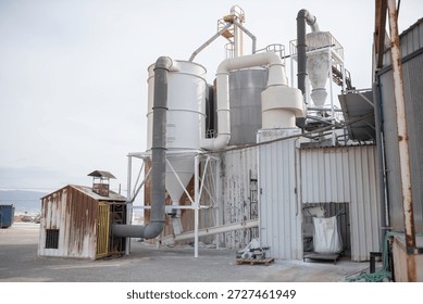 Industrial silos and ventilation systems at processing plant, manufacturing or chemical industry promo.
