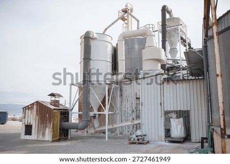 Industrial silos and ventilation systems at processing plant, manufacturing or chemical industry promo.