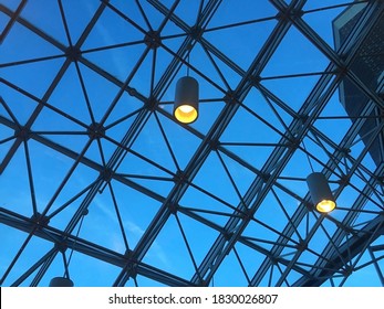 Industrial Skylight Under A Dark Blue Early Morning Sky With Two Lighting Fixtures