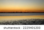 Industrial skyline at sunset, view across Delaware River, from Fort Mott on New Jersey side, Pennsville Township, NJ, USA - November 7, 2022
