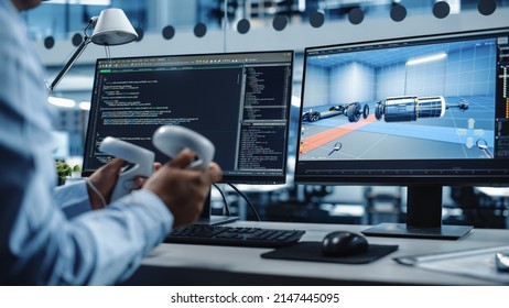 Industrial Software Developer Writing Code And Testing Automotive Manufacturing Interface. Engineer Editing Electric Motor And Car Chassis While Wearing Virtual Reality Headset And Using Controllers.