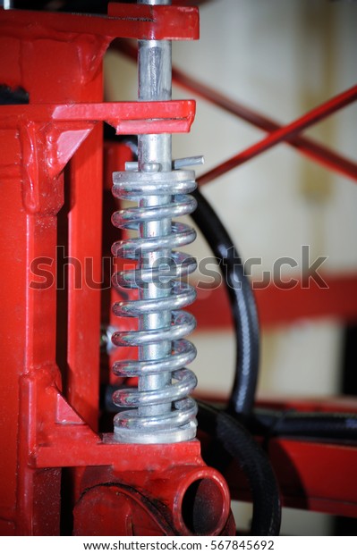 Industrial\
springs are seen at a agricultural\
fair