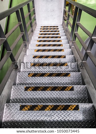 Industrial Stairs with warning tape