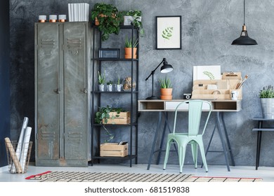 Industrial study room with metal wardrobe, rack and desk - Powered by Shutterstock