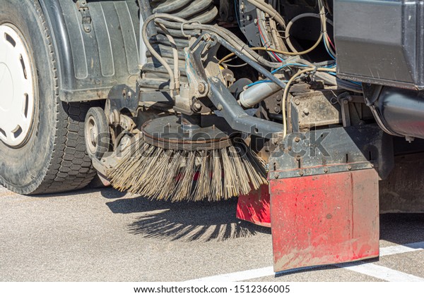 Industrial sweeper, road cleaner with brushes.\
Brushing the road. The concept of community road services, street\
cleaning. road\
equipment.