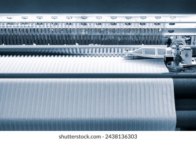 Industrial textile weaving machine in a weaving factory, industrial concept background