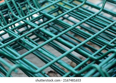 Industrial Texture Background: Green Metal Iron Grating, Turquoise Grid. Steel Grate In Perspective. Garden Fence, Lattice