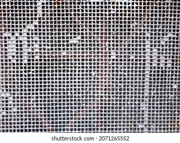 Industrial texture background: old white metal iron grating, metallic grid or steel grate. Venting, ventilation. Mesh, lattice pattern