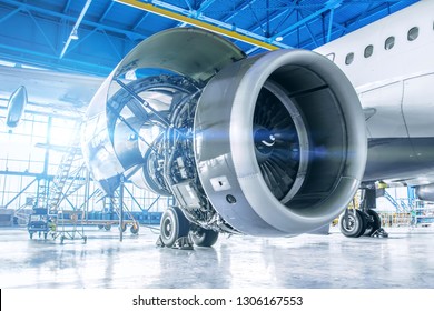 Industrial theme view. Repair and maintenance of aircraft engine on the wing of the aircraft