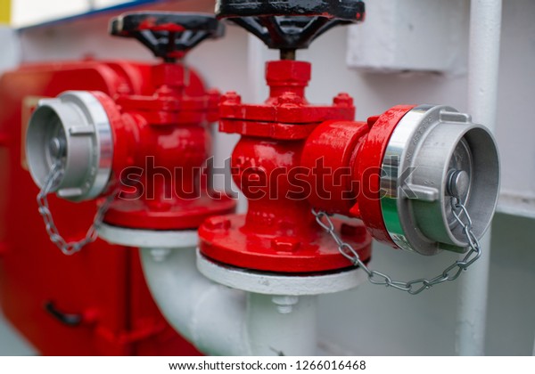 Industrial transfer of the red fire hydrant.
Water fire extinguishing system. Fire safety. Manual gate valve on
the fire hydrant.