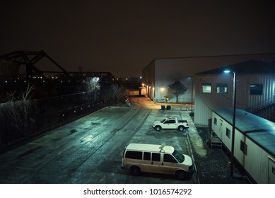 Industrial Urban City Night Scenery In Chicago With Warehouses, Van, Pickup Truck, And A Vintage Bridge.