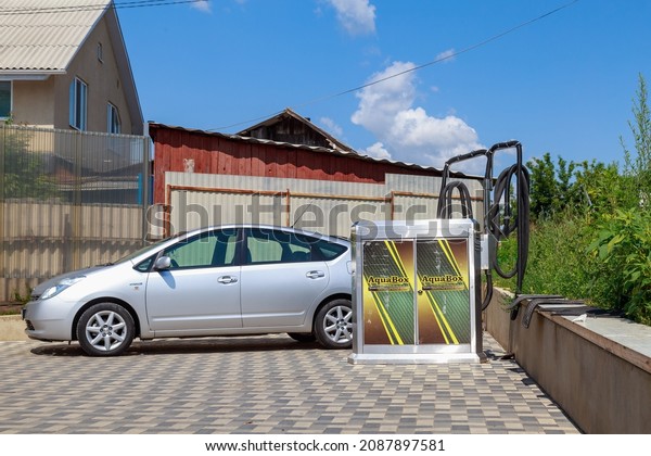 Industrial vacuum cleaner at a modern city\
car wash. Background with copy space for text or lettering.\
Illustrative editorial. July 23, 2021, Balti\
Moldova.