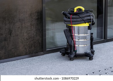 Industrial Vacuum Cleaner Standing Outside The Office Building.