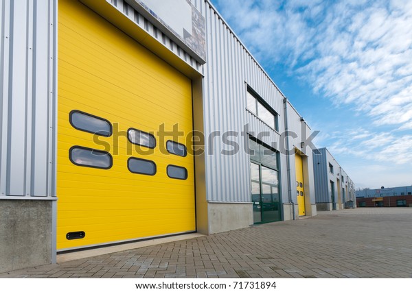 industrial
warehouse with green and yellow roller
doors
