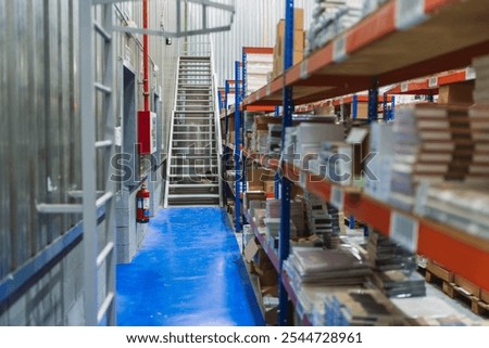 Similar – Image, Stock Photo Industrial warehouse staircase with a glimpse of neon light