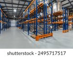 Industrial Warehouse Interior Featuring Organized Shelving Units and Inventory Storage.The interior of a spacious industrial warehouse showcases a systematic arrangement of shelving units. Tall racks