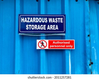 Industrial Warning Sign Board For Denoting Hazardous Waste Chemicals Storage Area. Warning Sign For Alerting Employees Working In The Factory.