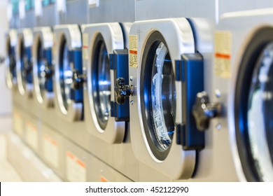 Industrial Washing Machines In A Public Laundromat.