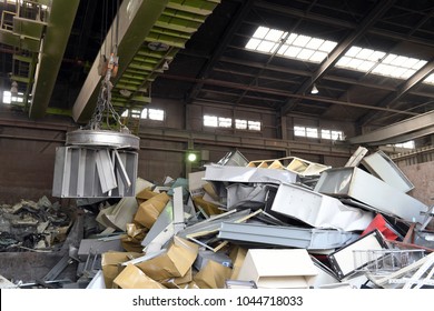 Industrial waste recycling plant to sort metal junk - Powered by Shutterstock