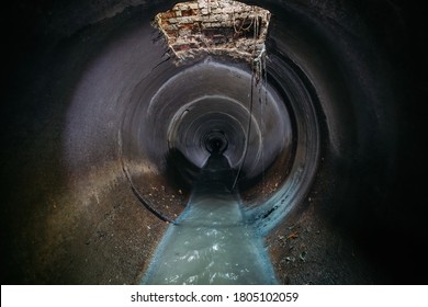 Industrial Wastewater And Urban Sewage Flowing Through Round Sewer Pipe