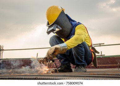 Industrial welder welding fabricated construction in factory Welding process by Shielded Metal Arc Welding (SMAW) or Stick Welding
