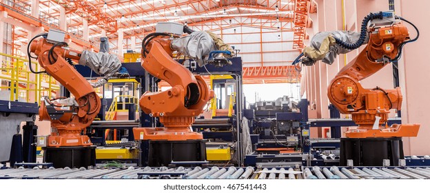 Industrial welding robots in production line manufacturer factory - Shutterstock ID 467541443