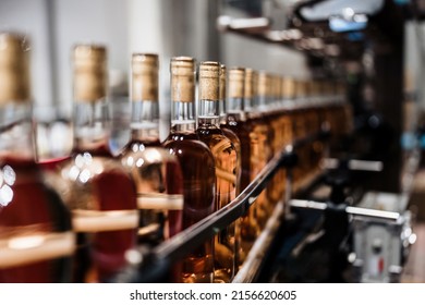 Industrial wine bottling plant theme. Modern industry production line for alcohol drink bottling and packaging.  - Powered by Shutterstock