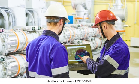 industrial worker with computer at power energy supply factory - Shutterstock ID 1734348587