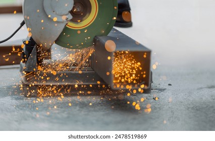 Industrial Worker Cutting Steel Square Pipe in construction site. - Powered by Shutterstock