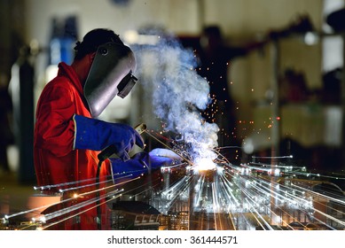 Industrial Worker At The Factory Welding Close Up