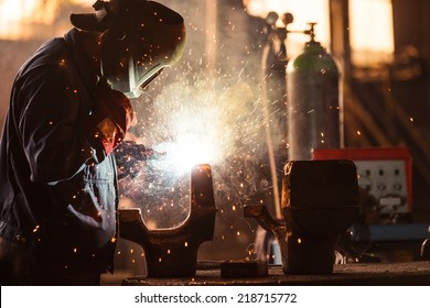 Industrial Worker At The Factory Welding Closeup