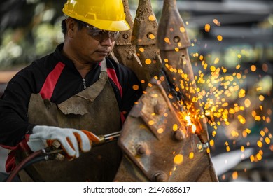 Industrial worker metal cutting with acetylene torch at factory welding steel structure, Welder is welding metalwork manufacturing construction maintenance service.