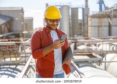 Industrial worker on his job at heavy industry plant - Shutterstock ID 2092878919