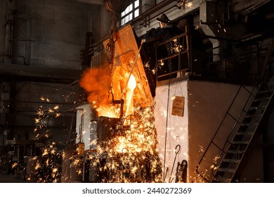 Industrial worker oversees molten metal pouring from furnace at steel mill. Foundry specialist in protective gear supervises smelting process. Heavy industry, high temp steel production. - Powered by Shutterstock