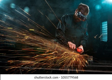 industrial worker with tools and sparks