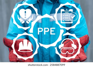 Industrial worker using virtual touch screen sees text: PPE. PPE Personal Protective Equipment and Safety Work Industry concept.