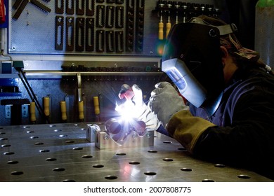 Industrial Worker At Welding Contraption