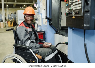 Industrial worker in wheelchair smiling while operating machinery in factory setting, showing determination and competence. Wearing helmet and safety gear, focused on task - Powered by Shutterstock