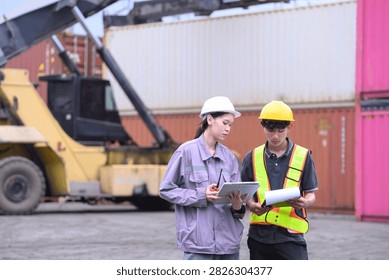 Industrial workers checking shipment documents and digital logistics data at shipping yard.