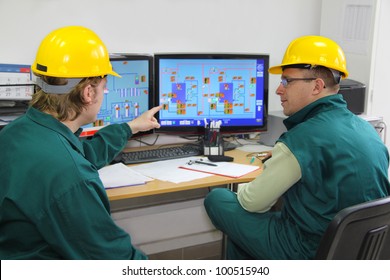 Industrial Workers In Control Room