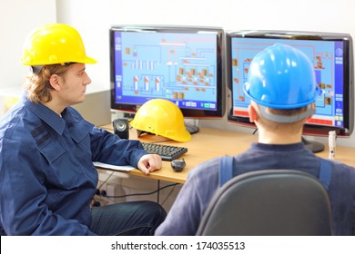 Industrial Workers In Control Room