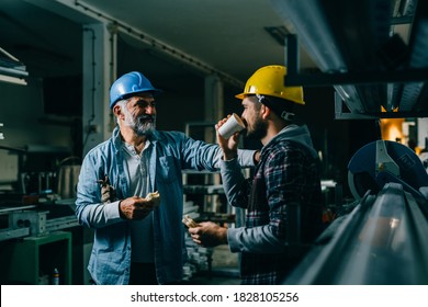 Industrial Workers Having Lunch Break