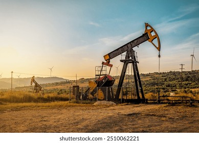 Industrial working oil pump on crude oil field at sunset - Powered by Shutterstock