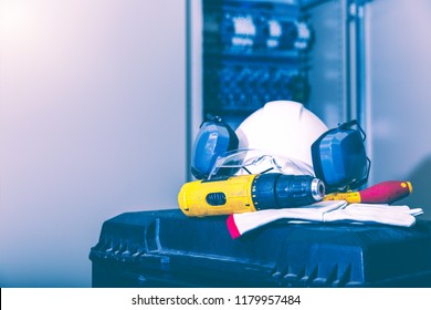 Industrial Working With Safety Concept, PPE  (Personal Protective Equipment) For Professional Worker Or Electrician. Electric Drill , Hardhat, Glove And Transparency Glasses Put On Tool Box.