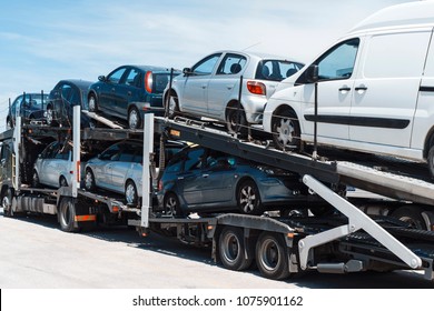 Industrial zone, Varna, Bulgaria - April 2018: Cars on the car are lined up in a row. Passenger vehicles are well secured to the trailer car carrier. Cars sale
