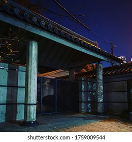 Industrial-cross-traditional Japanese Architecture In Tokyo Alleyway At Night.